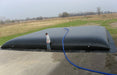 Gray Water Storage Bladder Tank being filled with hose