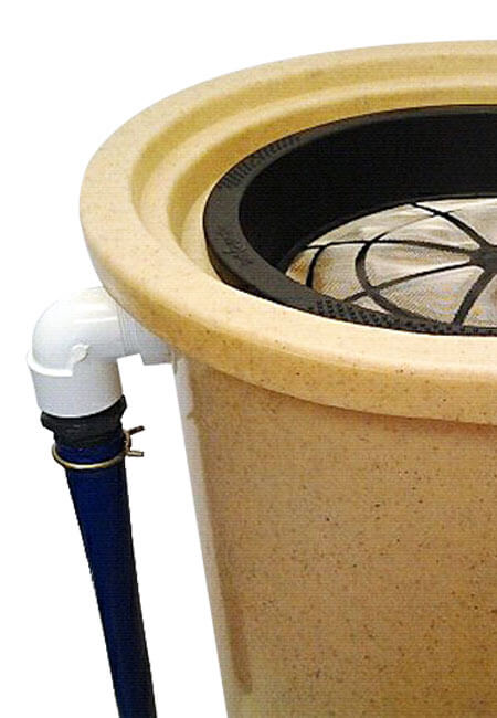 Lay Flat Hose Kit connected to rain barrel