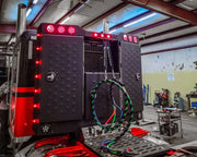 Iconic Angled Vader Stainless Steel Headache Rack on red truck left side