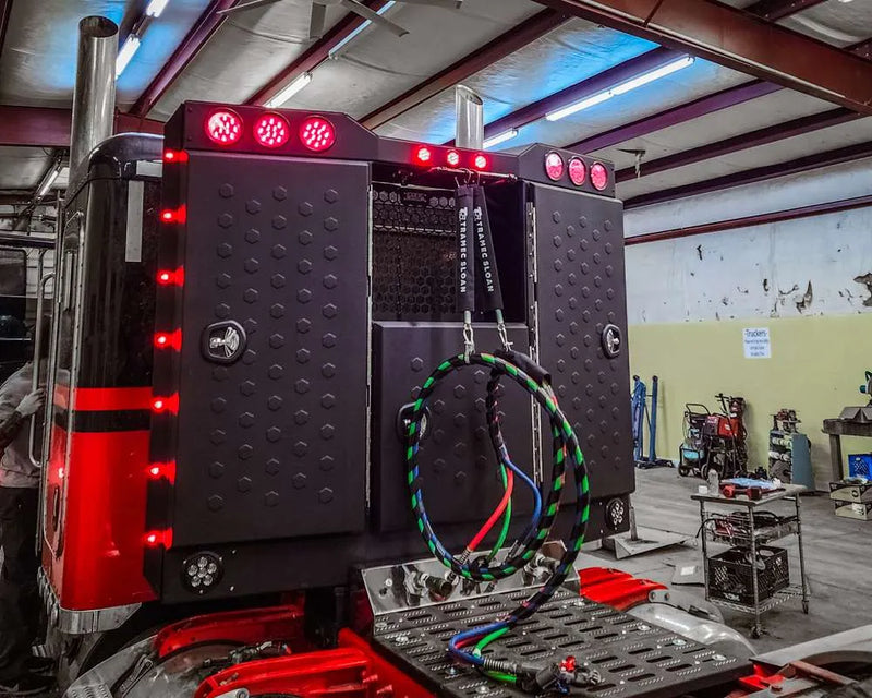 Iconic Angled Vader Stainless Steel Headache Rack on red truck left side