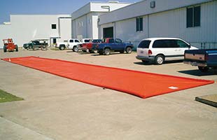 Husky Eagle Washdown Containment Mat in parking lot