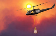Husky Flying Helicopter Tank on helicopter at sunset