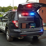 Mobile Strong SUV Storage Drawer for Ford Interceptor mounted in cargo area with police lights on