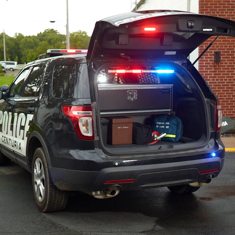Mobile Strong SUV Storage Drawer for Ford Interceptor mounted in cargo area with police lights on